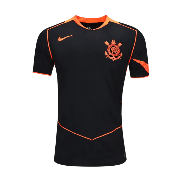 gratidao-instapost-224 | AE JERSEY Front view of a black soccer jersey with orange piping and a crest on the left chest.