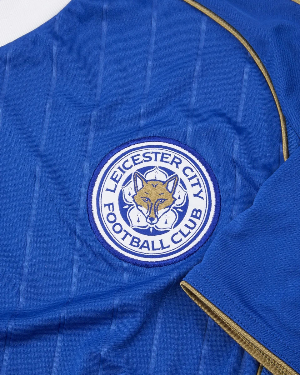 gu05qitjf9dtco5lrkni | AE JERSEY Leicester City Football Club badge on a blue striped jersey with gold piping.