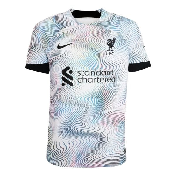 Liverpool FC home jersey with abstract multicolor ripple pattern, Nike swoosh and Standard Chartered logo visible along the chest.