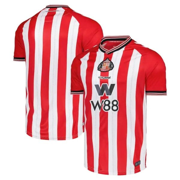 Red and white vertically striped soccer jersey with club crest and sponsor logo (front view).