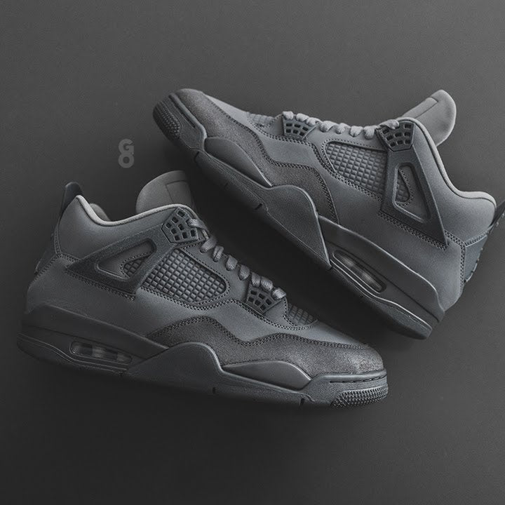 maxresdefault | AE JERSEY Pair of dark gray sneakers on a black background, showing mesh panels and visible air soles.