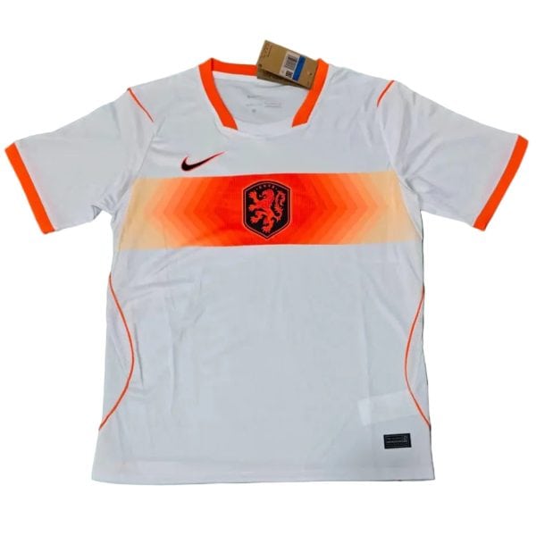 White Netherlands soccer jersey with orange chevron stripe across the chest, black Nike swoosh, and orange-trimmed sleeves and collar.