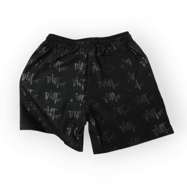 rn-image_picker_lib_temp_30d0e770-a5d9-422d-9406-69d533e79512 | AE JERSEY Black shorts with an all-over Dior logo print and an elastic waistband, shown from the waist area down.