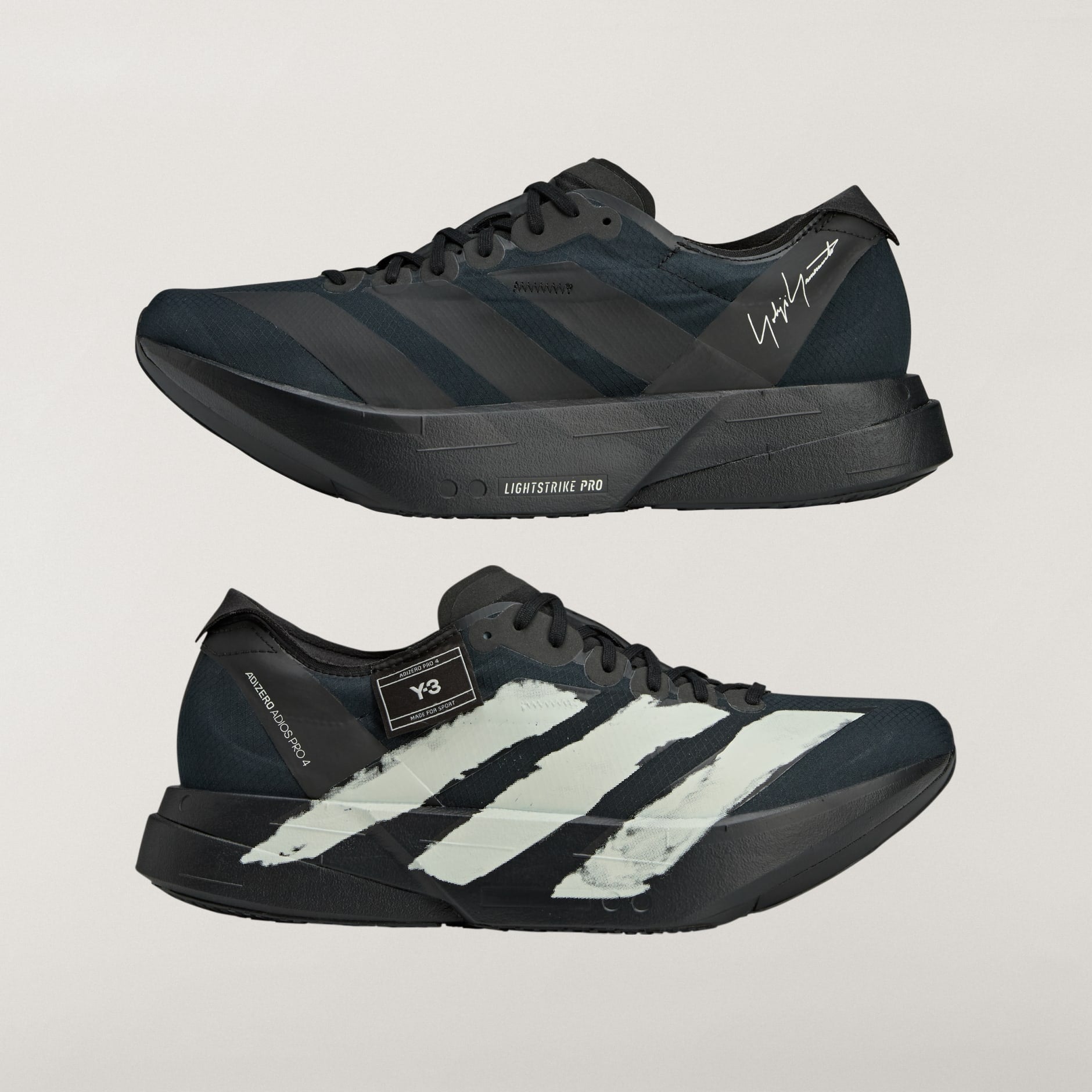 rn-image_picker_lib_temp_62f9adfb-548b-447c-85e5-e1c6bd33eb3c | AE JERSEY Close-up side view of a black athletic sneaker with a chunky platform sole and diagonal stripes.