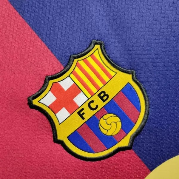 rn-image_picker_lib_temp_82a6152c-779d-4a0b-9035-6632936af2cc | AE JERSEY Barcelona football club crest placed on a diagonal red and blue background, featuring the yellow and red stripes and shield emblem with a ball.