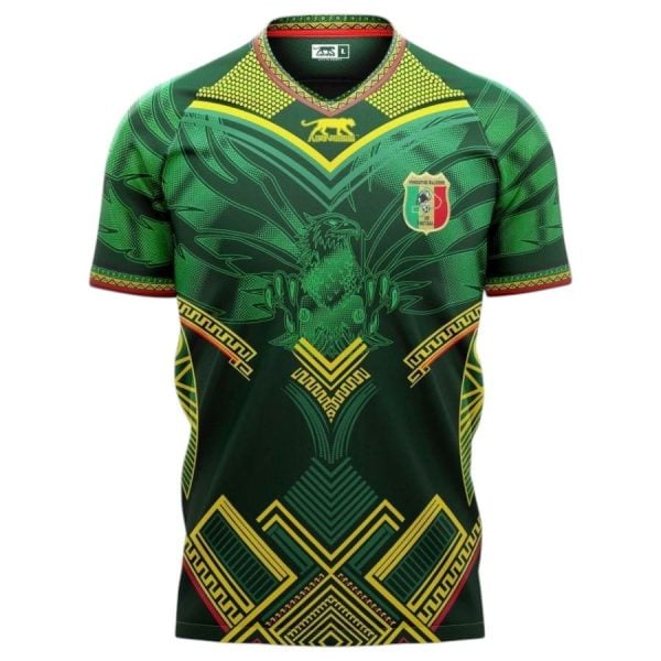 Green athletic jersey with gold geometric patterns, red trim, and a shield emblem on the left chest.