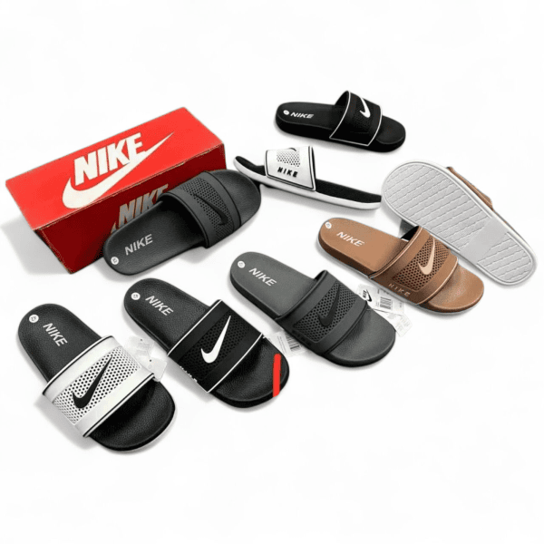 Assortment of Nike slide sandals in black, white, and beige with a red Nike box in the background