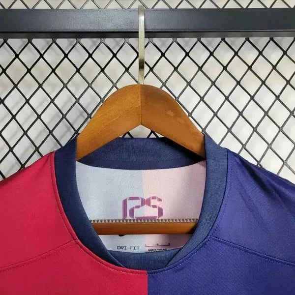 rn-image_picker_lib_temp_c3f67b26-f7da-4069-a59e-54f119d47338 | AE JERSEY Two-tone pink and blue color-block sports jersey on a wooden hanger, with a navy collar.