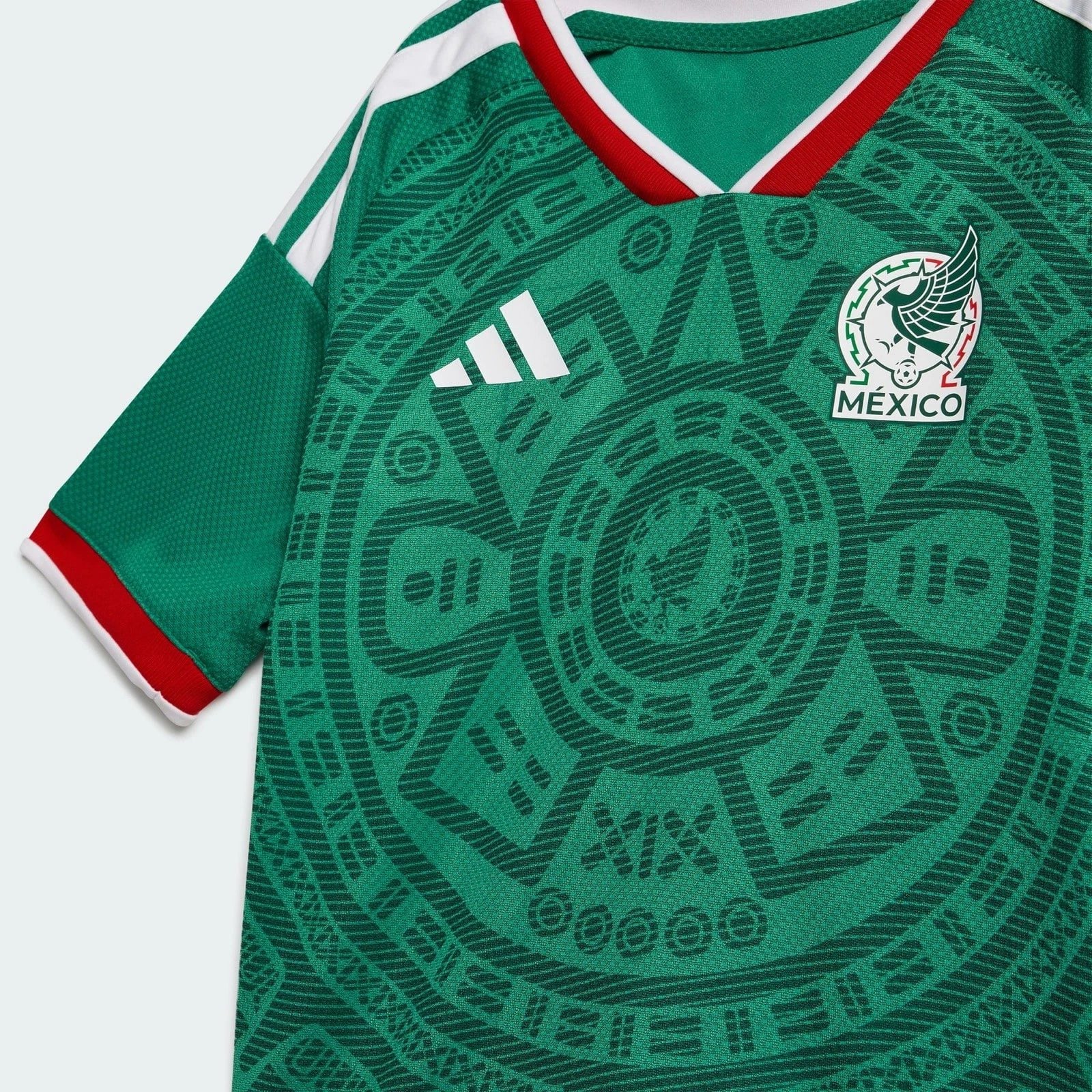 s-l1600_7_ff11a9ea-f44f-4e36-8954-5c4267531b66 | AE JERSEY Close-up of a green Mexico national soccer jersey, showing the Adidas logo and team crest on the chest.