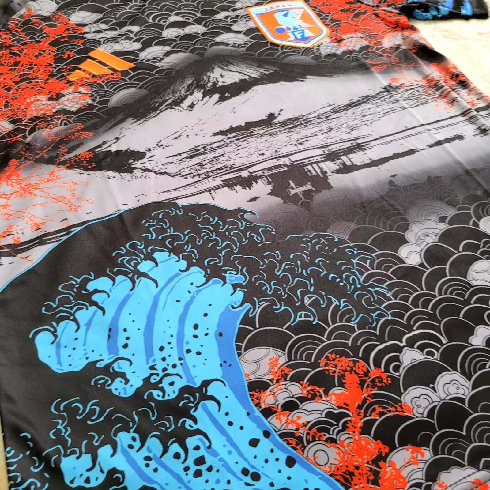 s-l1600_8_ea4a58d8-c5a5-4038-832c-f6dbbe4ac8ff | AE JERSEY Decorative textile with bold blue waves, a black-gray seigaiha pattern, and bright orange floral accents.