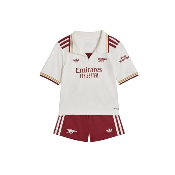 White polo shirt with maroon trim and Emirates Fly Better logo, worn with maroon shorts featuring white stripes and Arsenal crest.