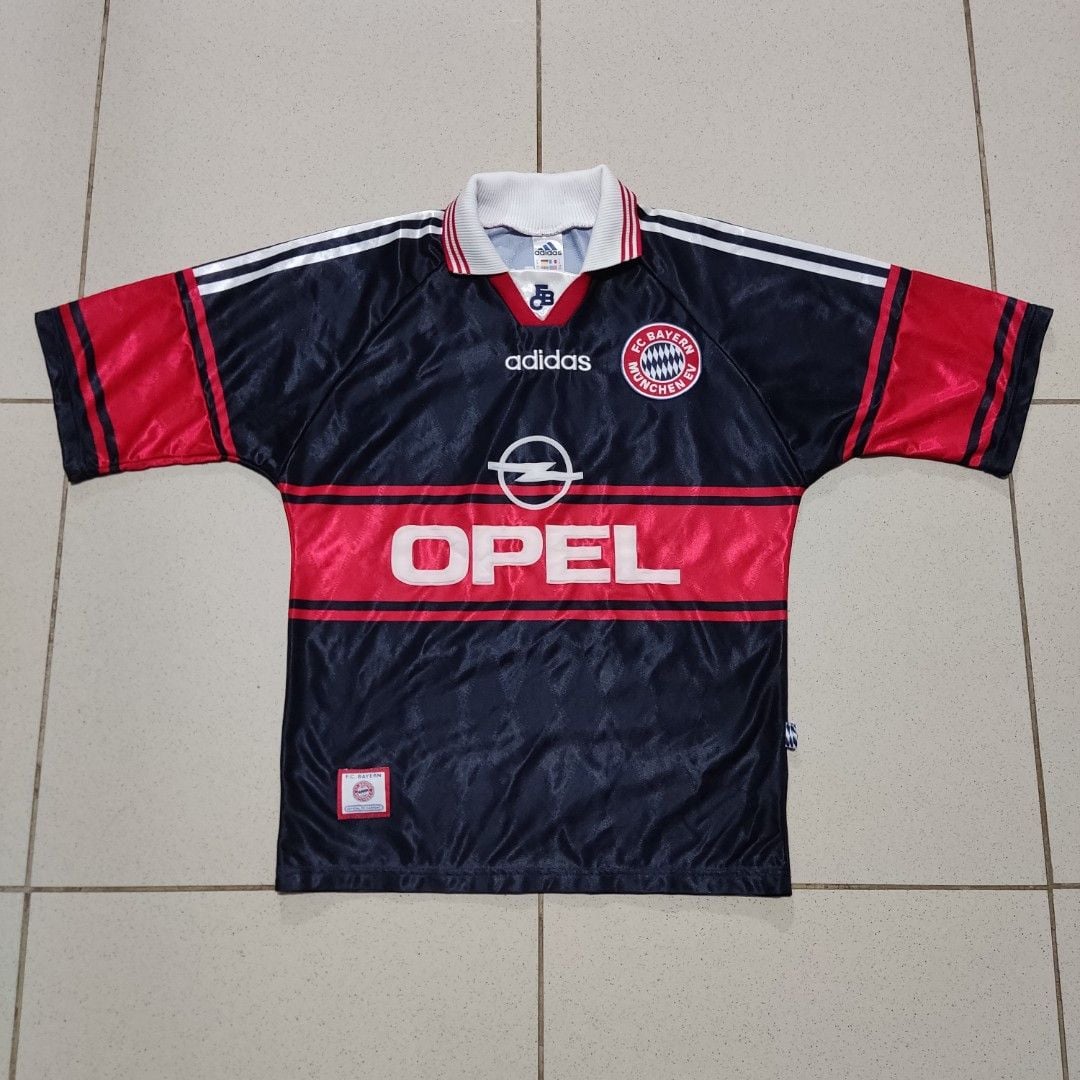 vintage_adidas_9799_fc_bayern__1668084639_02b35926_progressive | AE JERSEY Dark navy Bayern Munich jersey with a red horizontal band, Opel sponsor, Adidas logo, and club crest on the chest.