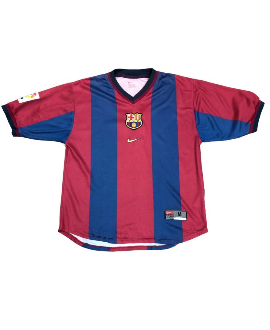 FC Barcelona soccer jersey with blue and maroon vertical stripes, crest on chest, Nike swoosh, and size M.