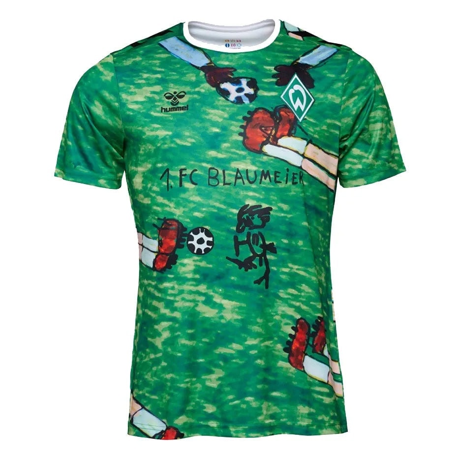 werder-bremen-2024_green_special-edition_1 | AE JERSEY Green soccer jersey featuring cartoon drawings, a white collar, Hummel logo, and a team crest on the chest.