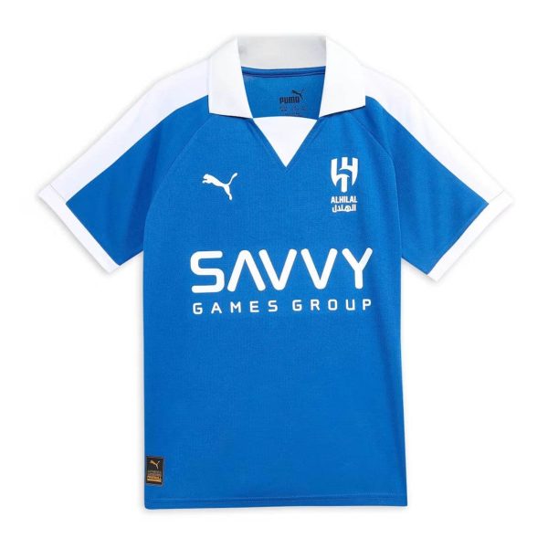Blue soccer jersey with white collar and sleeve trim, featuring Puma logo, Al Hilal crest, and SAVVY Games Group sponsor.